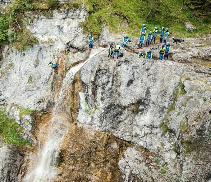 Canyoning at the top of a waterfall